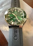 $2400 Oris Aquis Date Automatic 39MM Men's Green Watch 01 733 7732 4157. Fixed Price $1349.00.