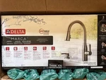 Delta Marca Pull-down Sprayer Kitchen Faucet With Shield Stainless. Fixed Price $140.00.