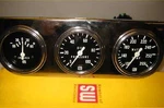 2 5/8" Stewart Warner Nos Super Car Gauge Set Black Face. Fixed Price $449.00.