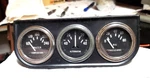 1975 3-STEWART Warner Gauges W/black Bracket Oil Pressure,alternator,water. Fixed Price $95.00.