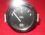 Vintage Stewart Warner Big Block Logo 2 1/8" Fuel Level Gauge 6 Volt Flat Glass. Fixed Price $125.00.