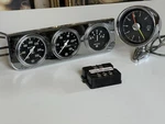 Stewart Warner 8,000 Pedestal Tachometer, Temp, Pressure, Amp' Ignition Monitor. Fixed Price $1400.00.